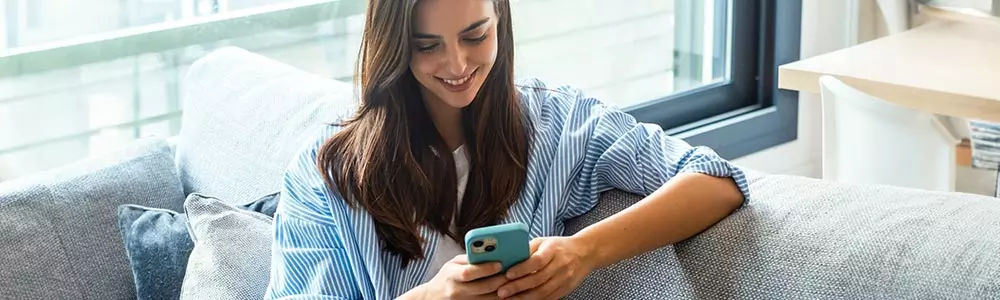 young woman gaming on her mobile device