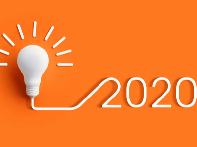 white light bulb and 2020 on an orange background